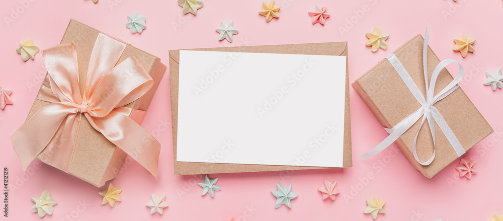 Gifts with note letter on isolated pink background with sweets, love and valentine concept