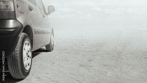 Car on the lonely deserted road. Car rental and travel concept. Copy space for text.