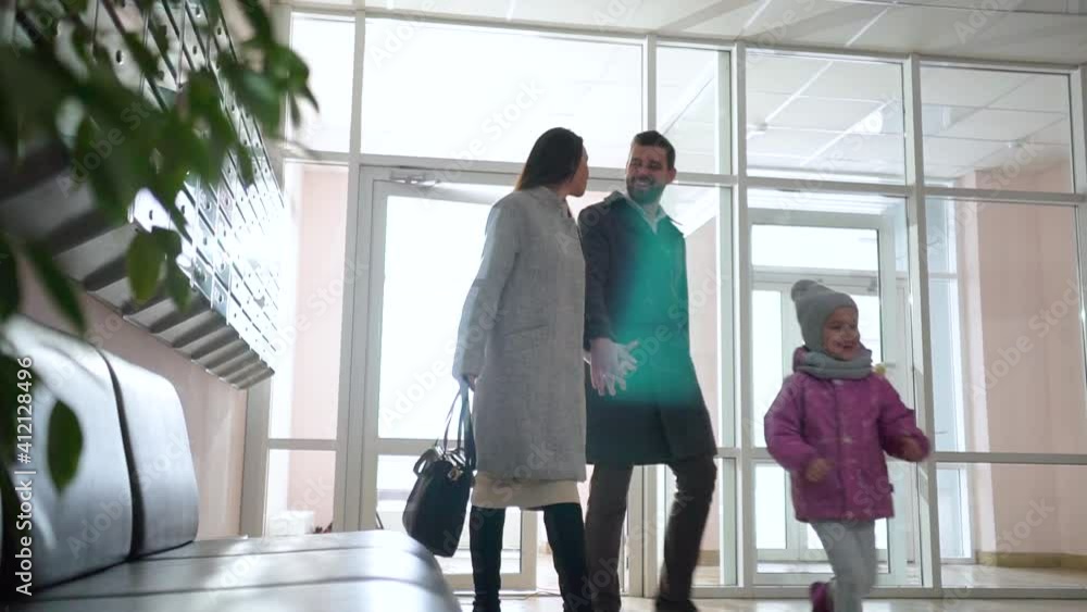 family with a child enters the house family with a child enters the house