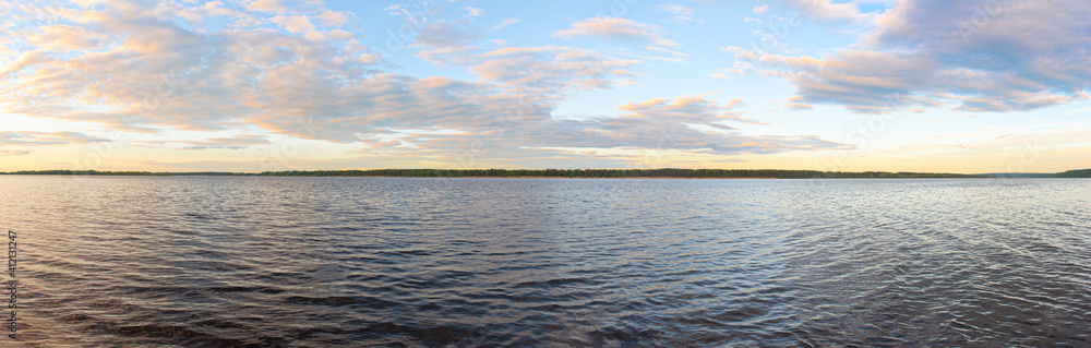Panorama of the wide river on a summer evening