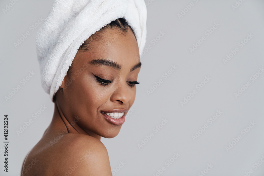 Sensual african american woman in bath towel smiling at camera Sensual african american woman in bath towel smiling at camera