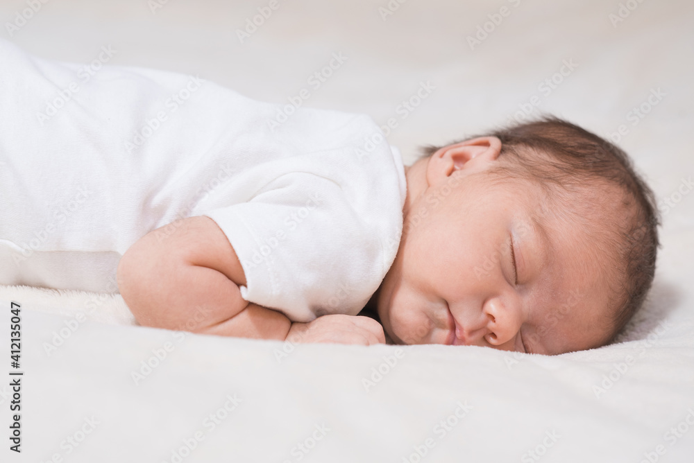 Cute, small and adorable newborn baby girl sleeping Cute, small and adorable newborn baby girl sleeping