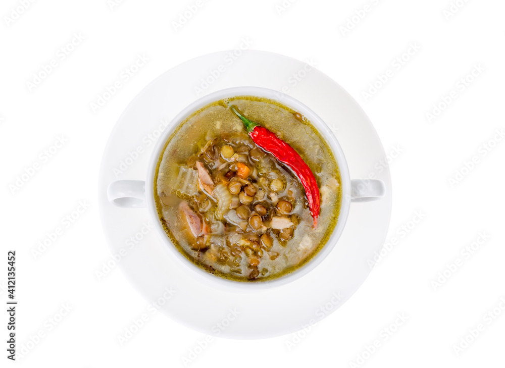 Spicy green lentil chili soup on white plate. Spicy green lentil chili soup on white plate.