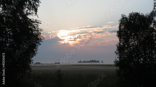 dawn in the misty field