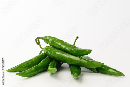 Green chilli on white background