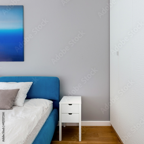 Simple white bedside table, close-up