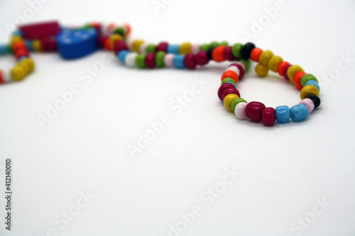 A bracelet made of beads on a white background.