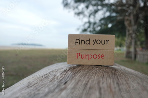 Conceptual image: Wooden blocks written Find Your Purpose at outdoor. Selective focus or Depth of field