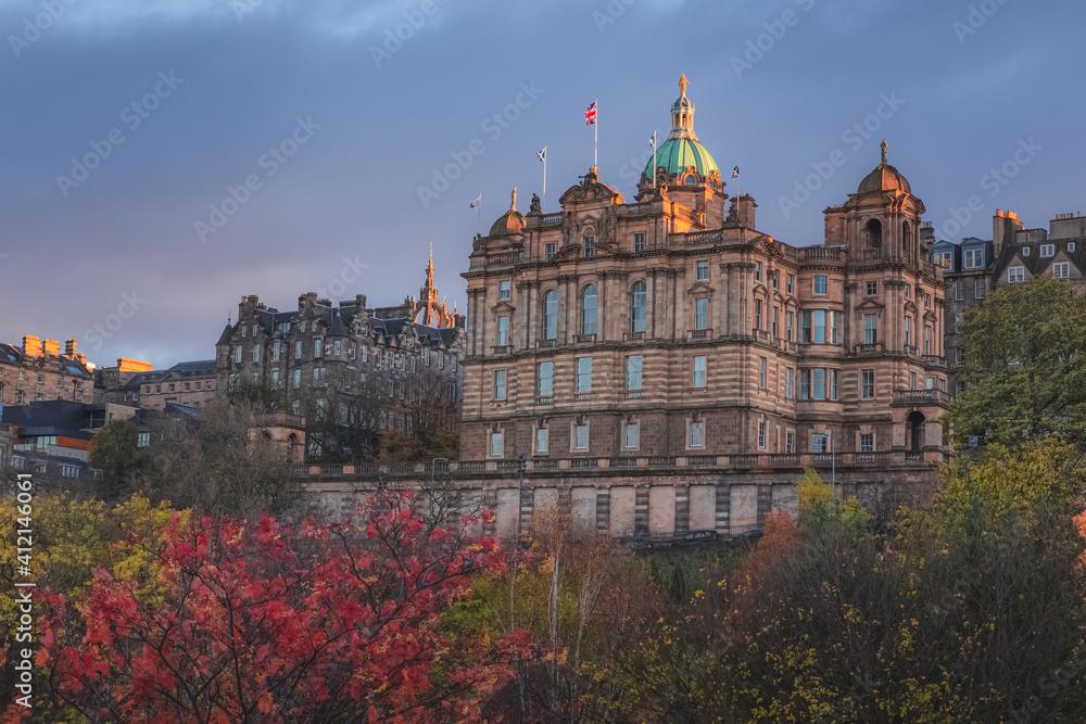 Autumn view at sunset or sunrise from Princes Street Gardens of Museum on the Mound off the Royal Mile in old town Edinburgh housed in the head office for Bank of Scotland.