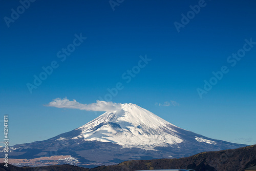 Close up famous view of Fuji mountain with snow cover on the top with could, Japan