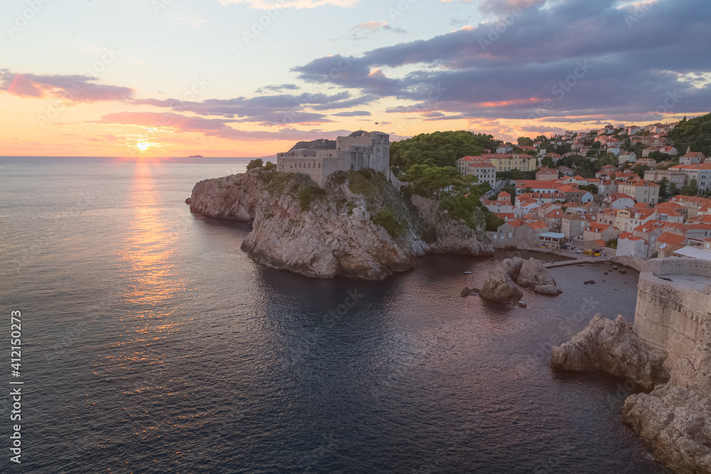 Sunset or sunrise cityscape and seascape view from the historic city walls of Old Town Dubrovnik, Croatia.