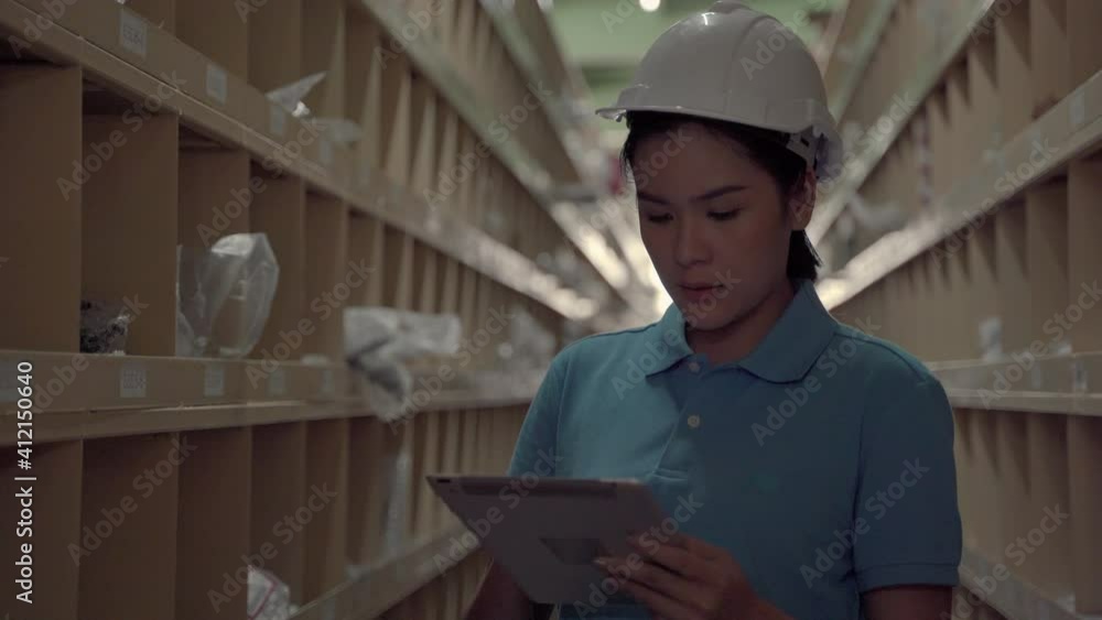 crane follow video shot of Asian female worker patrolling the goods placed on the shelves in the warehouse
crane follow video shot of Asian female worker patrolling the goods placed on the shelves in the warehouse