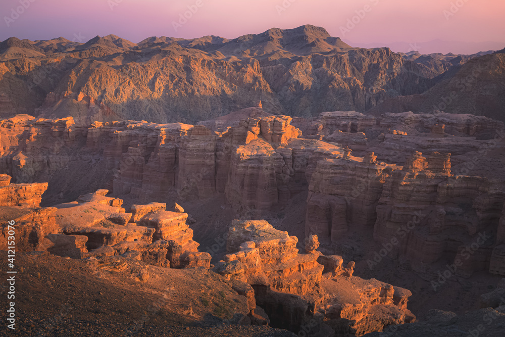 Rugged sunset or sunrise view of badlands landscape and terrain in Charyn Canyon National Park in the Almaty Province of Kazakhstan.