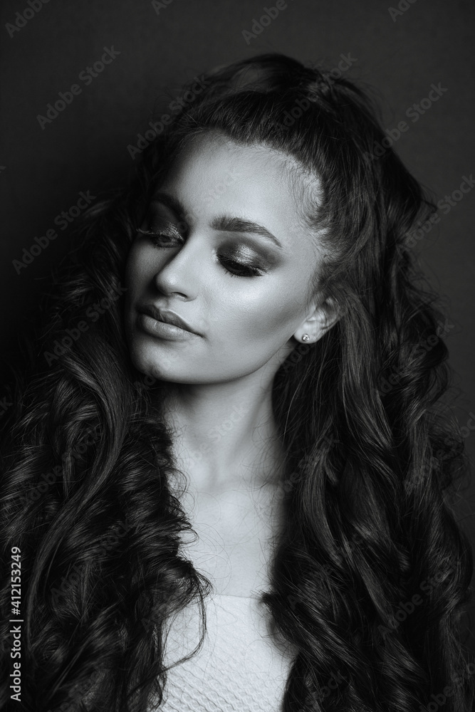 Fabulous woman with curly hair posing in the dark Fabulous woman with curly hair posing in the dark