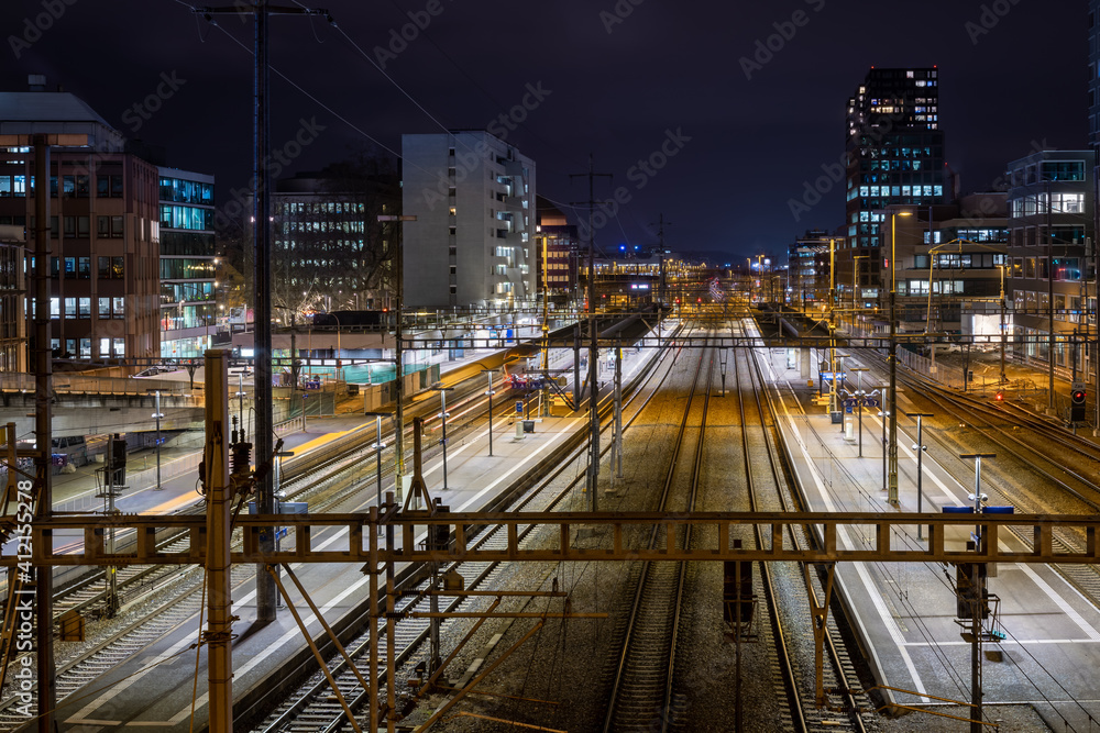 Night view of Zurich Altstetten train station in front of Zurich city