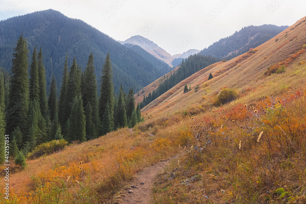 A hiking trail in the landscape of Kolsai Lakes National Park, located on the north slope of the Tian Shan Mountains in southeast Kazakhstan. A hiking trail in the landscape of Kolsai Lakes National Park, located on the north slope of the Tian Shan Mountains in southeast Kazakhstan.