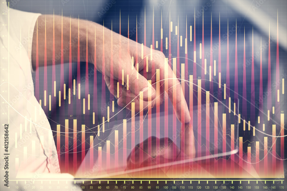 Double exposure of man's hands holding and using a digital device and forex graph drawing. Financial market concept. Double exposure of man's hands holding and using a digital device and forex graph drawing. Financial market concept.