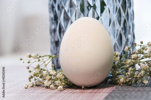 Easter egg with Baby's Breath flowers photo