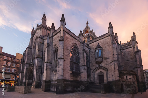 Closeup detail of gothic architecture of St, Giles' Cathedral against a dramatic sunset or sunrise sky along the Royal Mile in Edinburgh's Old Town.