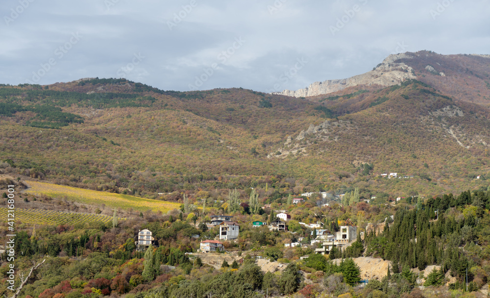 Obraz premium Gorgeous view of the high green mountains with houses. Discover the world of beauty.