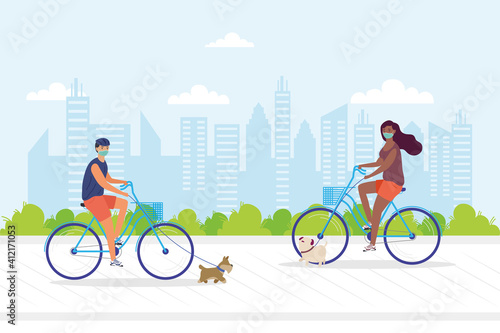 young couple wearing medial mask in bicycles with pets