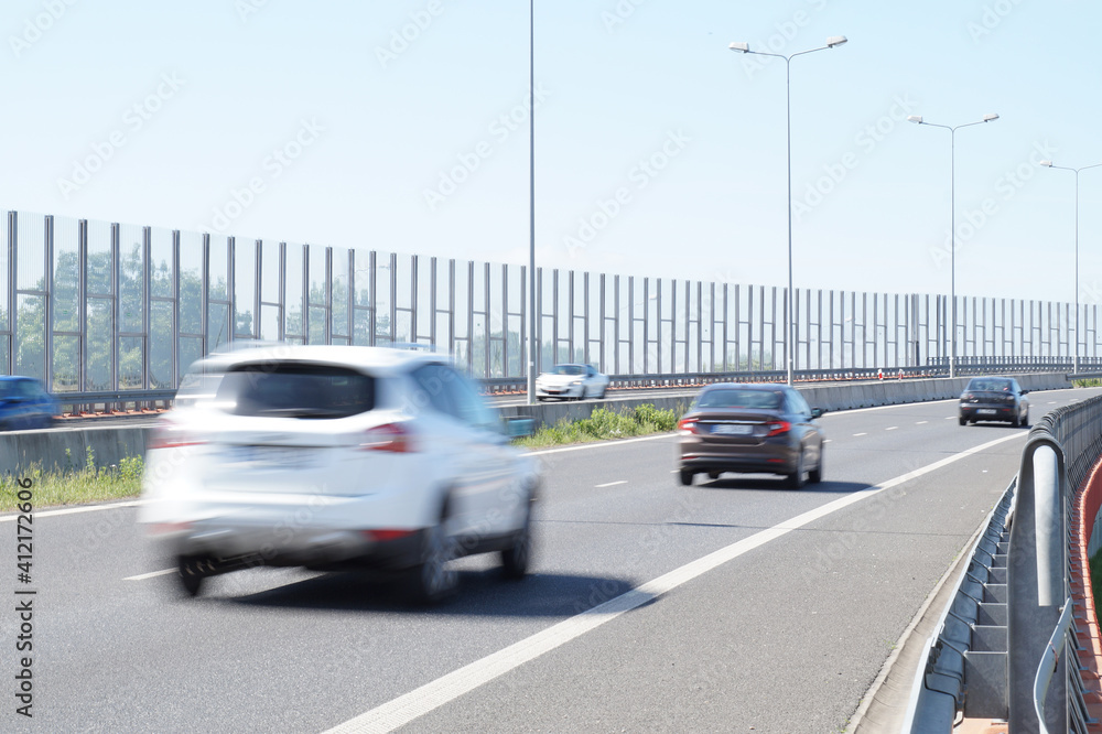 The motorway is enclosed with acoustic screens. Barriers protect local residents from traffic noise.