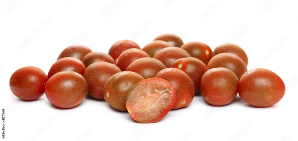 Mini kumato tomato pile isolated on white background Mini kumato tomato pile isolated on white background