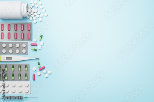 Blank blue mockup background with lots of pharmaceutical medicine pills, tablets, capsules and thermometer placed leftwards. Medication concept. Mockup. 3D rendering © Who is Danny