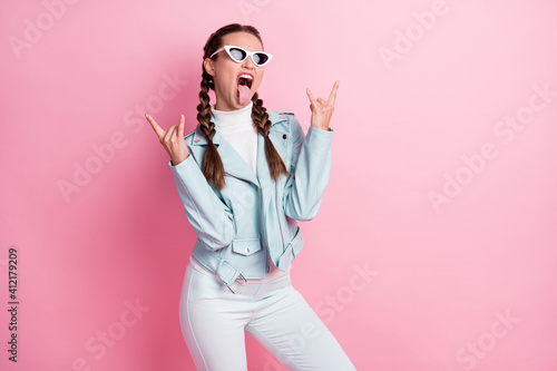 Valokuva Photo of young attractive crazy brutal girl tongue-out show fingers rock heavy m
