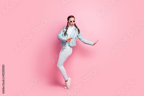 Full size photo of young excited girl happy excited have fun wear sunglass isolated over pastel color background