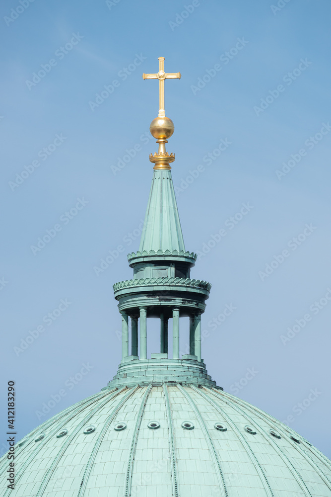 Big golden cross at the Dome of Evangelical church Saint Nikolai at blue sky, Potsdam, Germany, details, closeup. Big golden cross at the Dome of Evangelical church Saint Nikolai at blue sky, Potsdam, Germany, details, closeup.