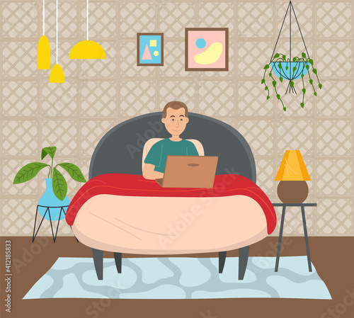 Man lying on the bed, holding a laptop and correspondence surfing the Internet. Male character communicating through network on the laptop. Social media network communication digital gadget addiction