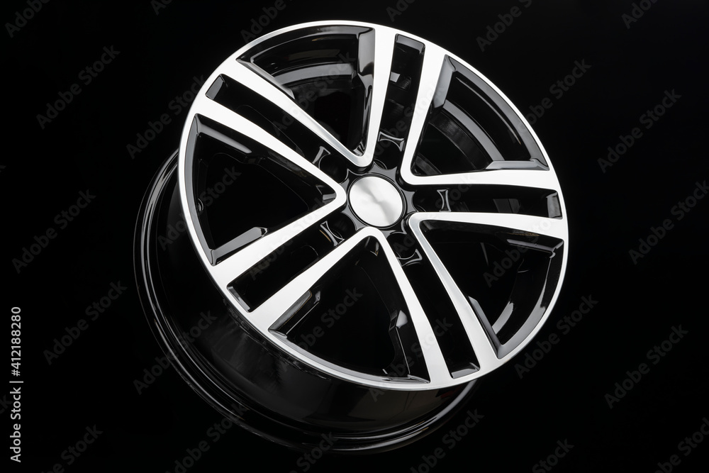 new shiny alloy wheel, color black with silver front. Dark background