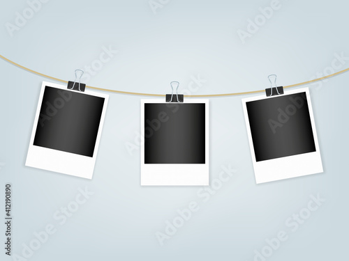 Retro photo frames hanging on rope with paper clips. White textured border. Vector illustration, flat design