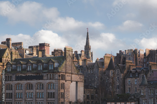 A view of Edinburgh's old town cityscape skyline on a sunny winter afternoon.