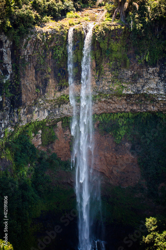 Waterfall flows into the crater of the volcano in Mauritius. National Park Chamarel.