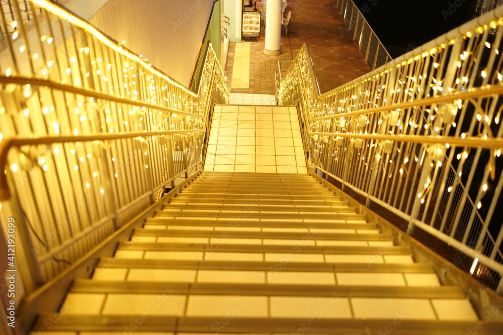 Obraz premium Stairway with Abstract lights. Defocused Glowing light bulb, copy space
