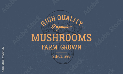 Mushrooms farm grown logo. Vintage mushroom logo, label, emblem. Mushroom on dark blue background. High quality, organic emblem for mushroom farms, food market. Vector illustration
