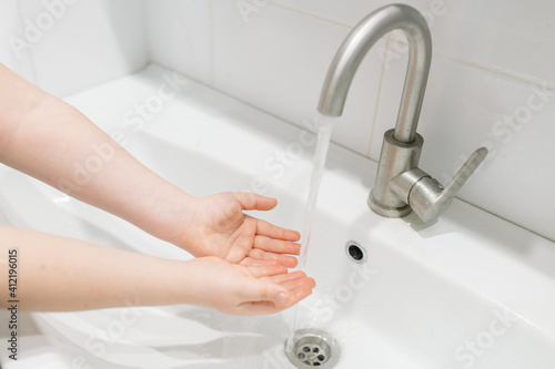 Washing hands in the bathroom. Real life in a pandemic  virus protection 