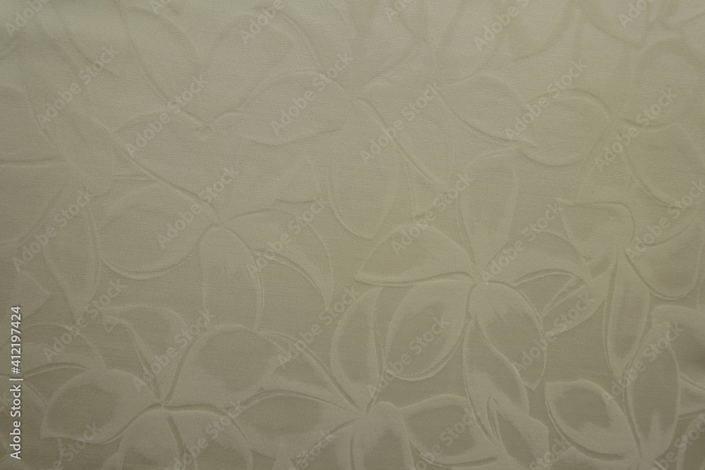 Top view of glossy cream colored polyamide fabric with floral pattern Top view of glossy cream colored polyamide fabric with floral pattern