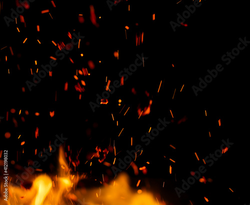Obraz na plátně flame fire with sparks on black background