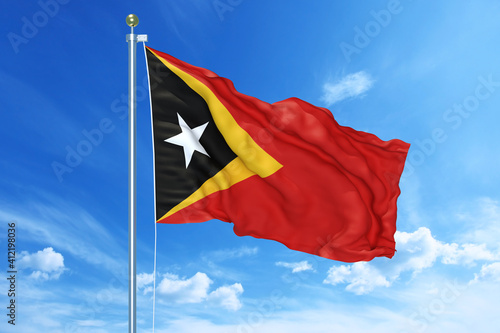 East Timor flag waving on a high quality blue cloudy sky, 3d illustration