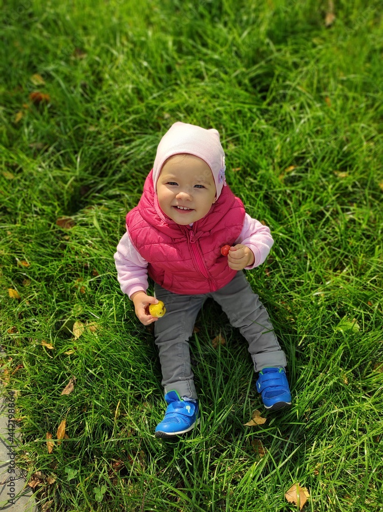 little child in the grass