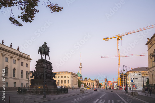 Photography Sunset or sunrise cityscape view of the Equestrian statue of Frederick the Great along Unter den Linden leading to the Berliner Dom and tv tower in Berlin, Germany