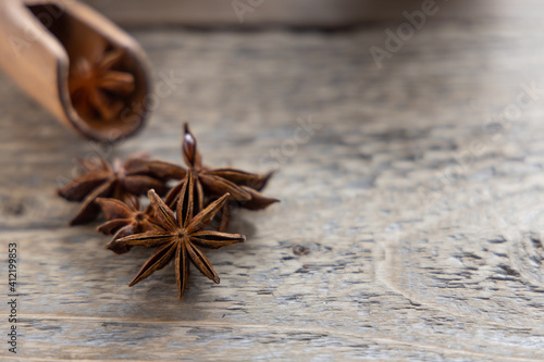 Star anise seed on a kitchen table. A spice commonly called star anise, staranise, star anise seed, Chinese star anise, badian that closely resembles anise in flavor.