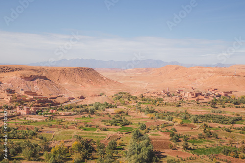Desert landscape view of oasis old town village Ait Benhaddou, Morocco a historic fortified village, noted for its ancient clay earthen architecture.
