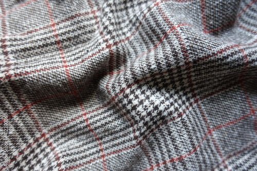 Rippled red and grey Glen check woolen fabric