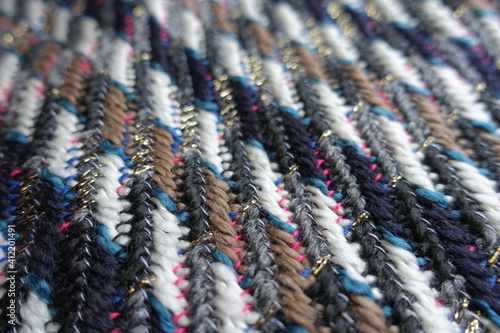 Close view of multicolored tweed fabric with lurex