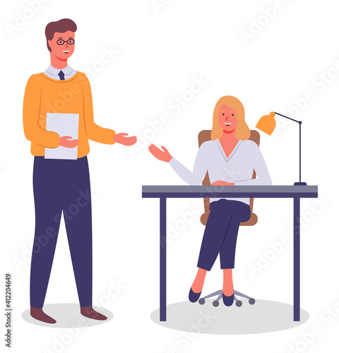 Meeting of colleagues in the office. Woman smiling sitting at a table, man standing holding paper document. Project management and teamwork concept. Businessman brought a report for verification