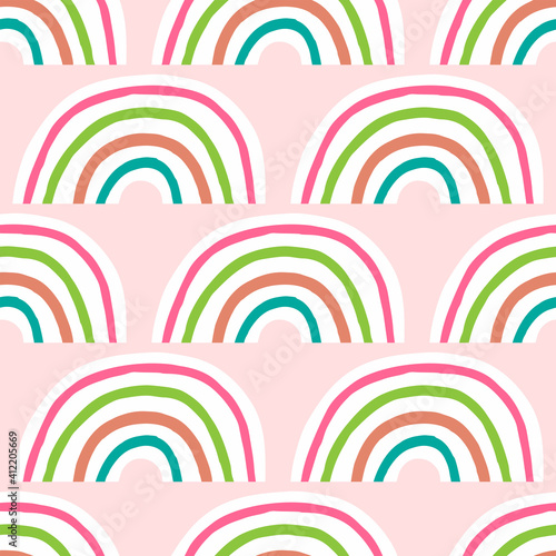 Cute seamless pattern with repeating rainbow. Drawn by hand. Girly vector illustration.